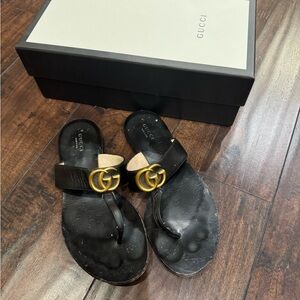 Authentic Gucci Black thong sandals with Gold hardware